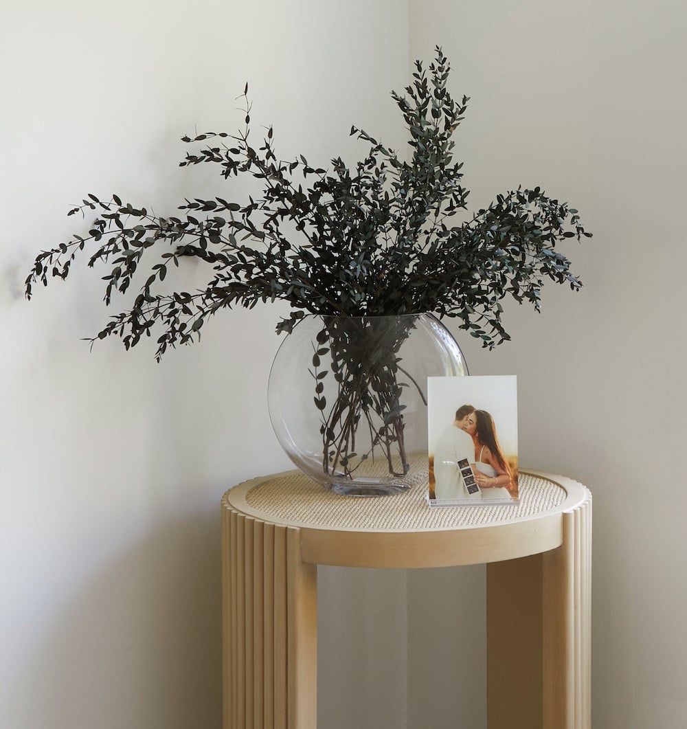 Frameology Acrylic Desk Print with stand on an accent table