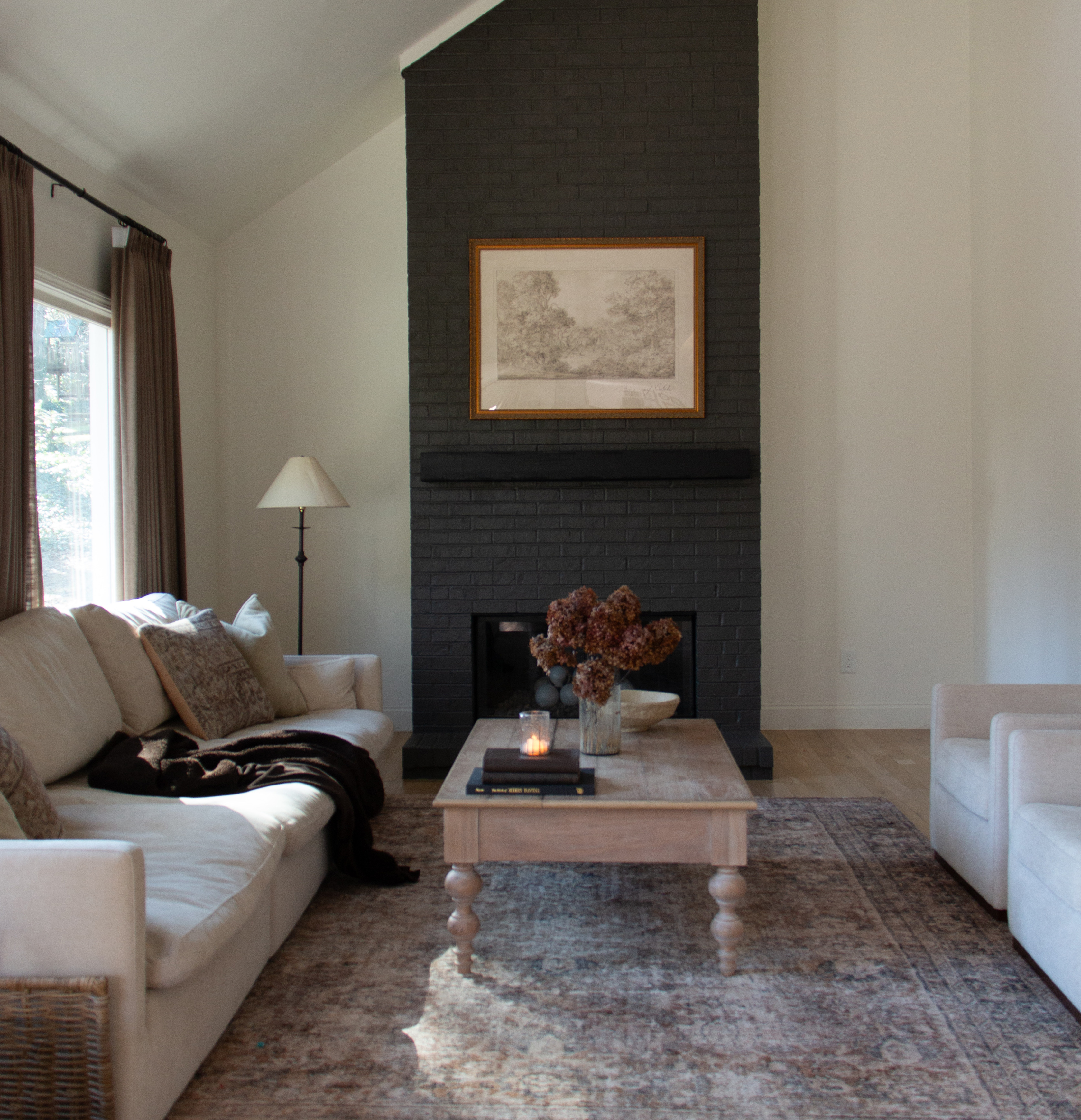 Frameology large Luxe Wall Wide frame in gold displayed in living room.