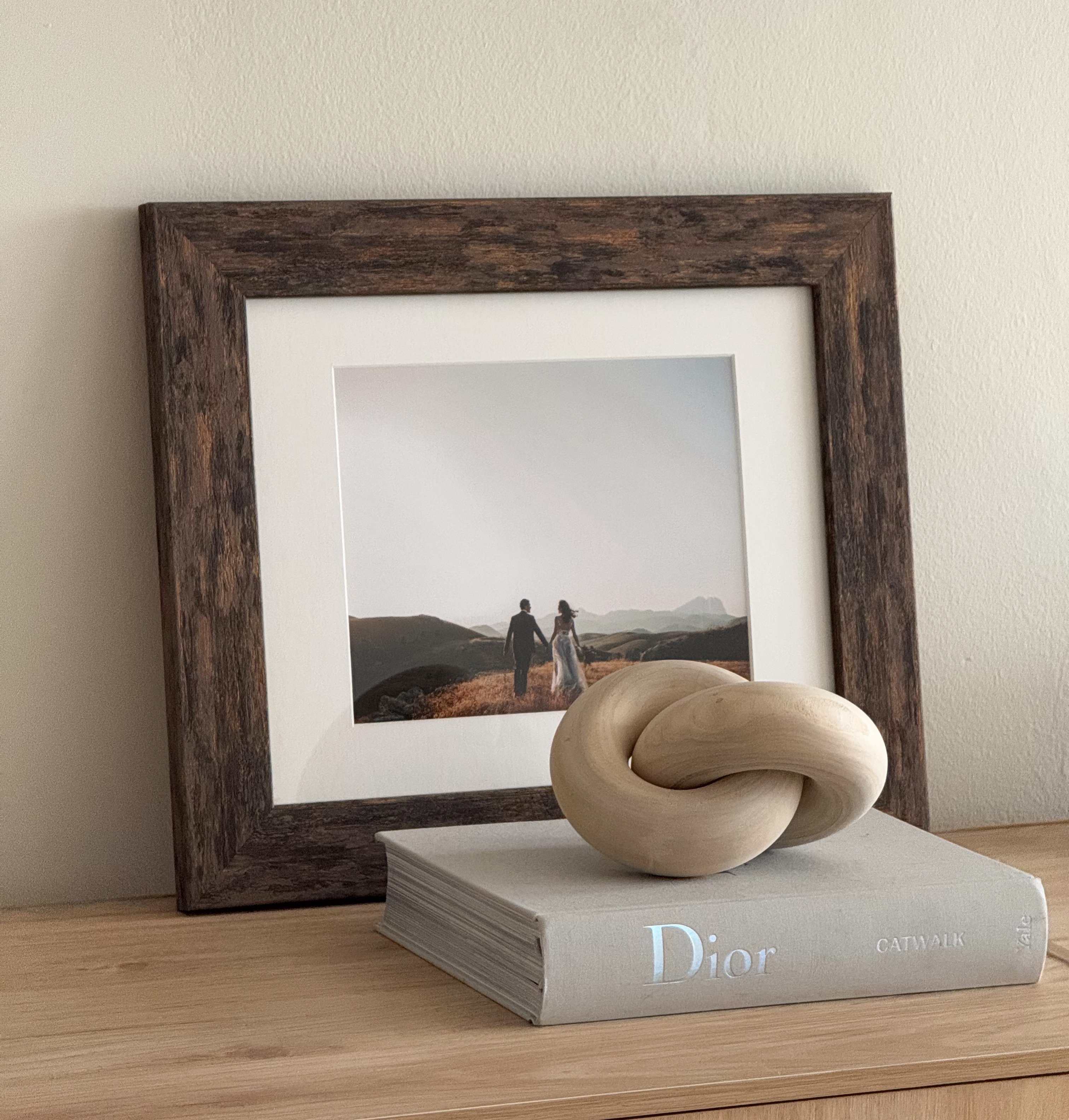 Brown Luxe Wall Wide frame with a photo of a bride and groom outdoors