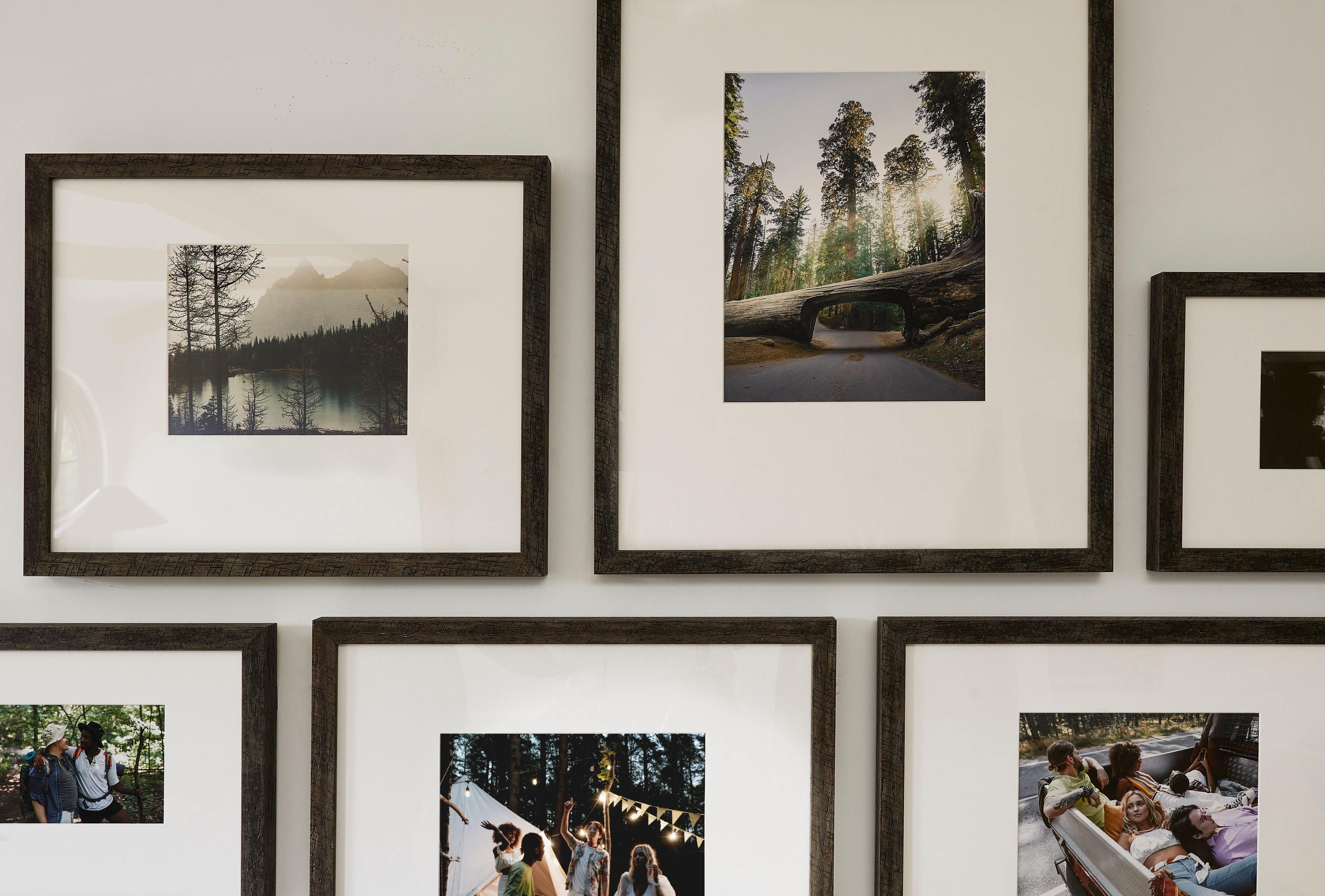 Close-up view of brown Luxe Wall frames with an offset mat