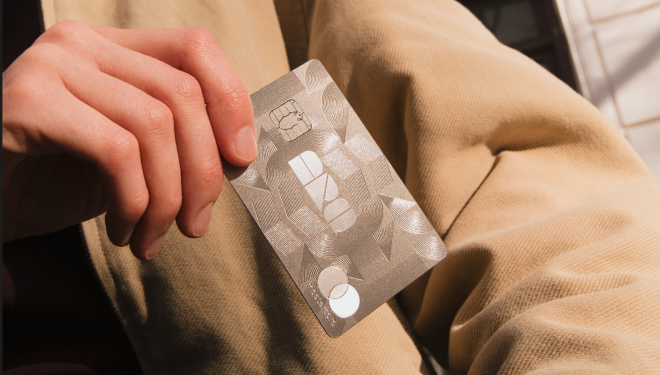 The ARQ Card held in hand — a prestige credit card