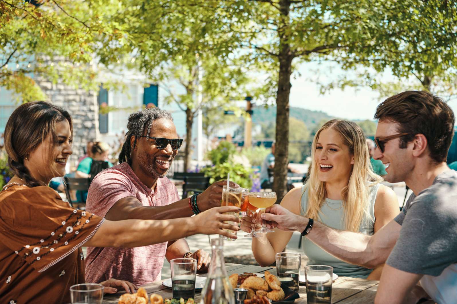 Guests enjoying lunch and cocktails at The Kitchen Table Restaurant's outside patio, inside James B. Beam Distilling Co.