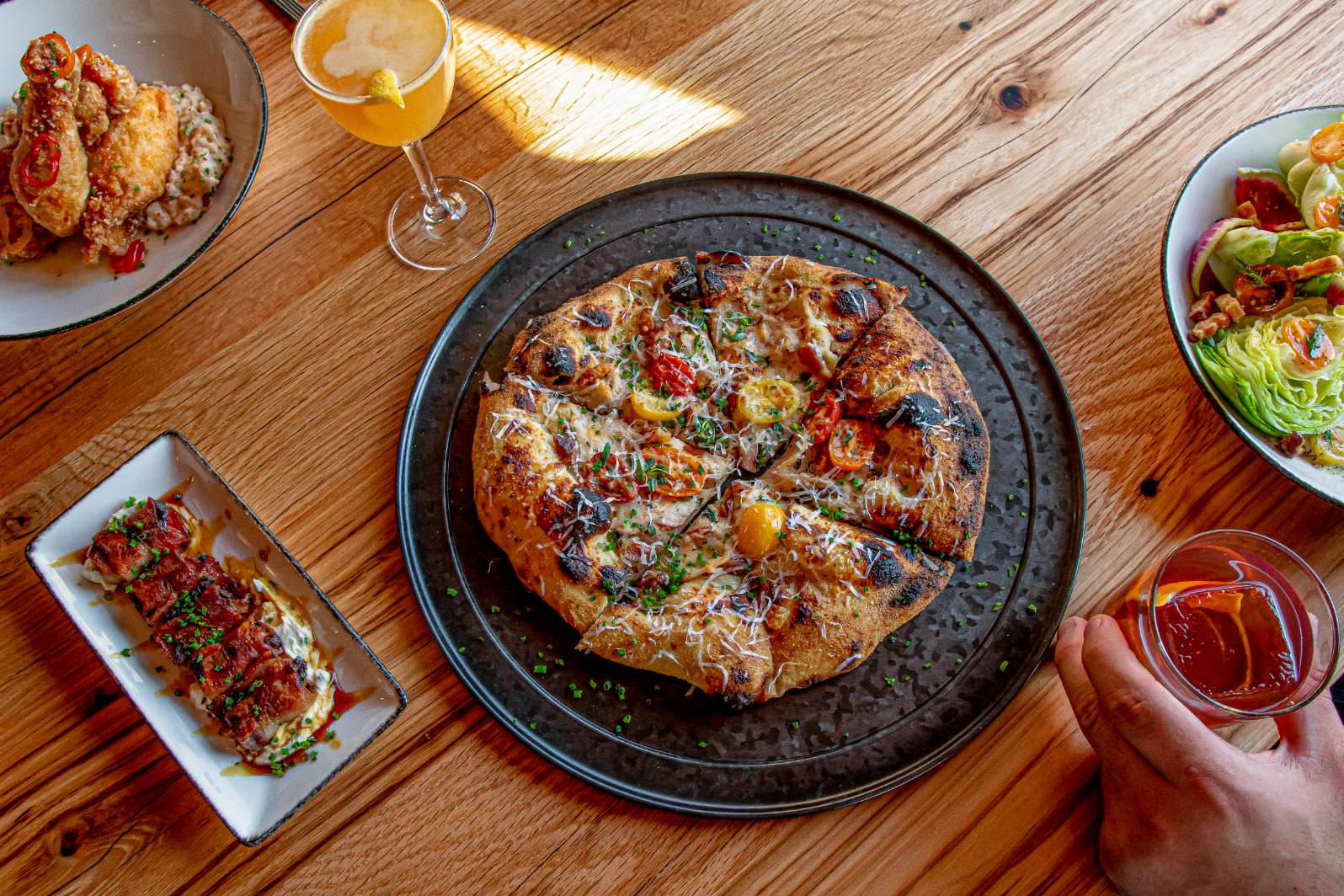 The Kitchen Table's signature dish is a sourdough pizza made with the same yeast strain used in the bourbon, baked in a proper Italian pizza oven.