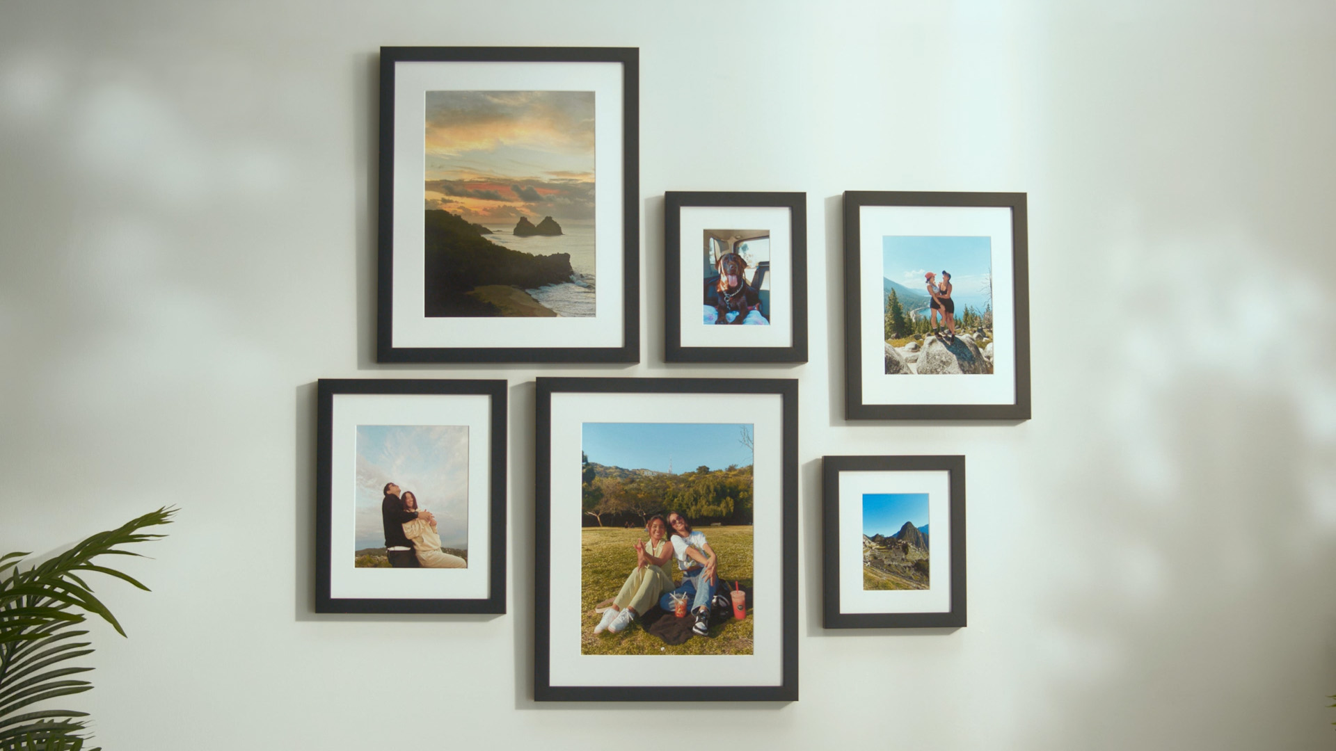 Vacation photos displayed on Classic Hallway II with black frames