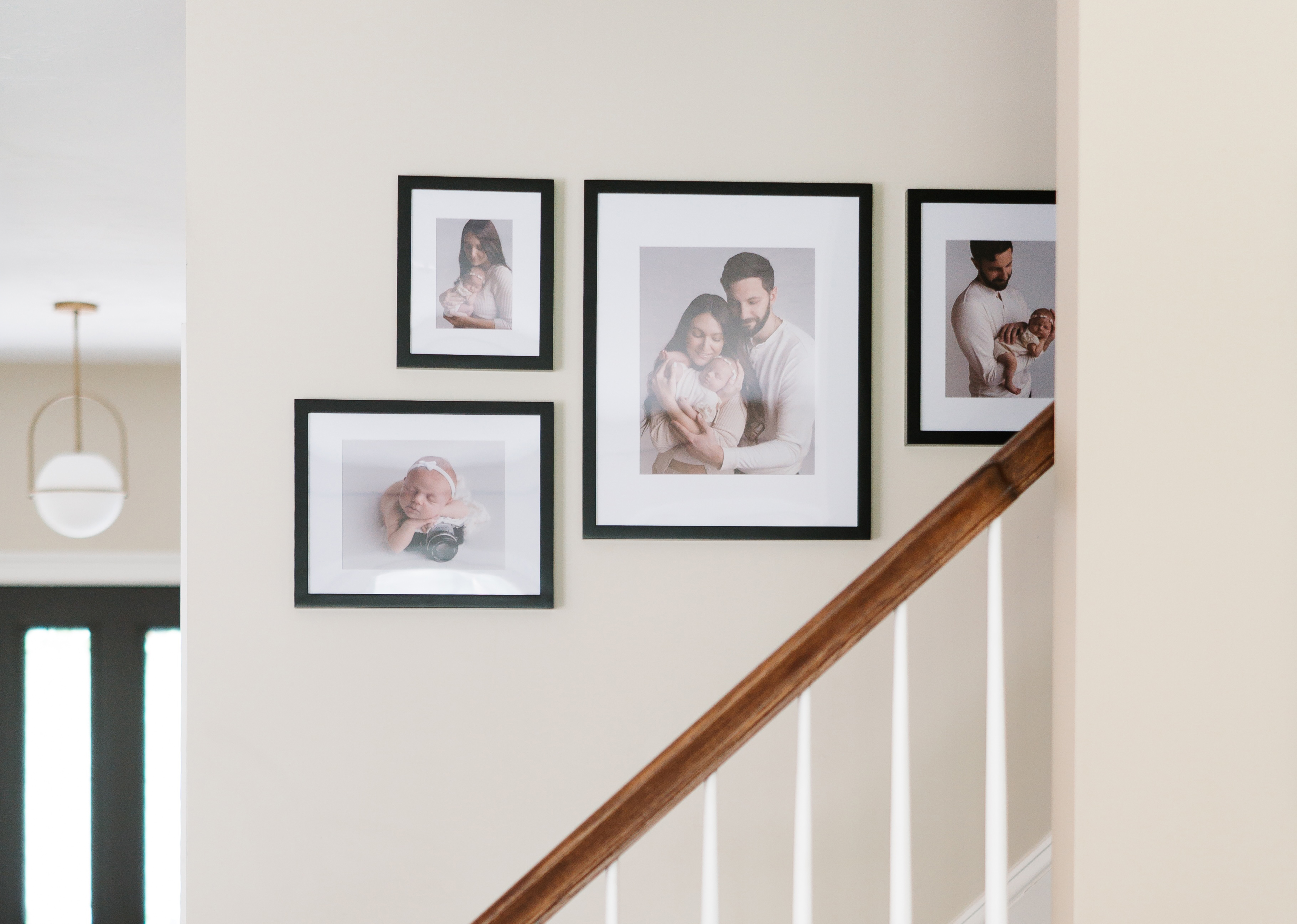 Classic Staircase in black with family portraits