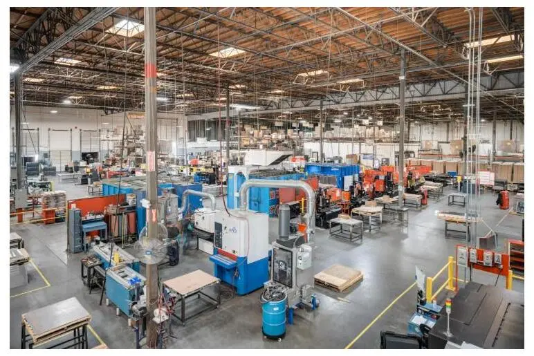 Wide view of the Fabcon precision sheet-metal fabrication floor with machining equipment.