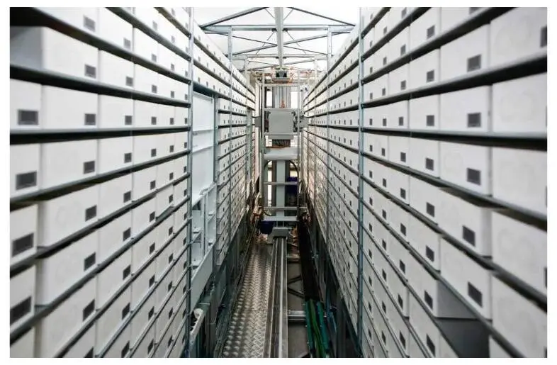 A data-center aisle lined with rows of server enclosures.