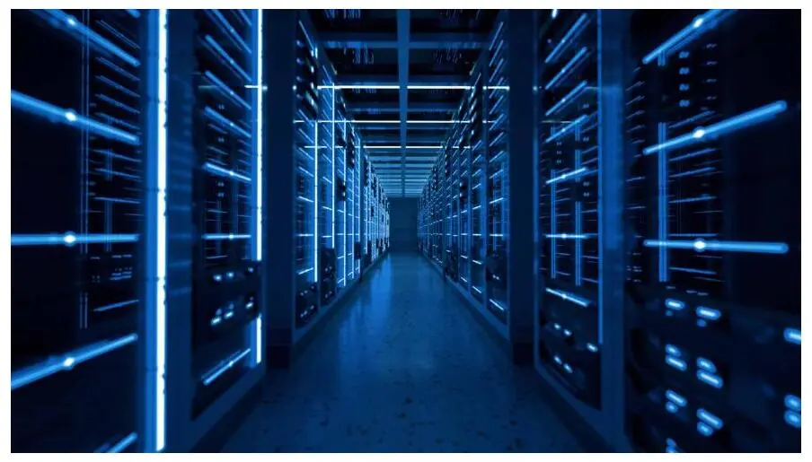A corridor of blue-lit server racks in a data center.