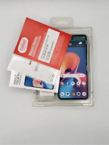 A packaged smartphone with a quick-start guide and retail insert.