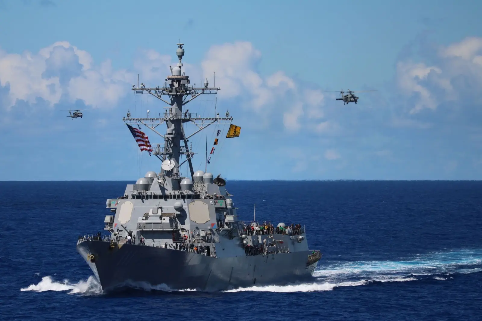 US Navy destroyer at sea, representing the defense industry