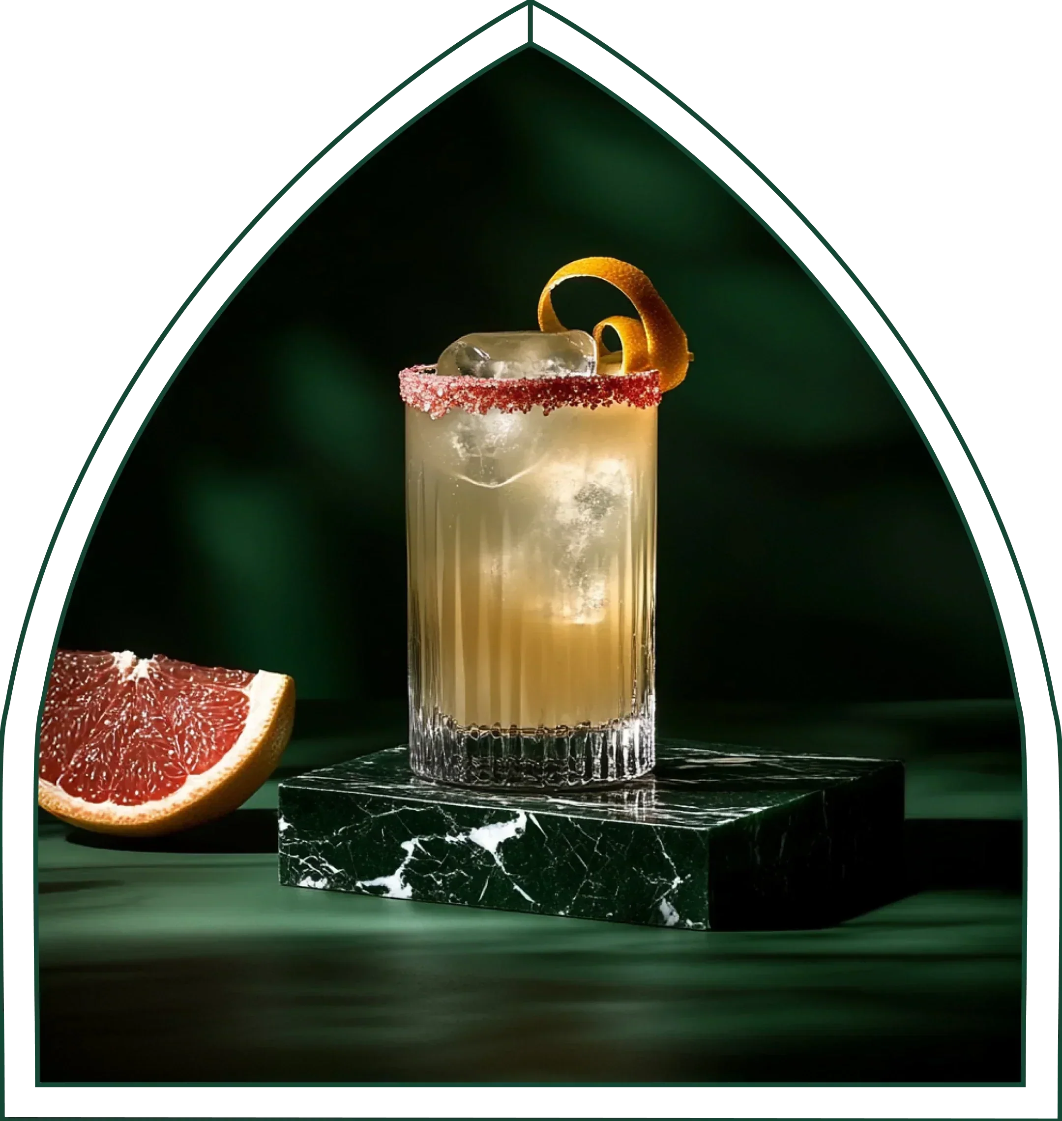 A tall non-alcoholic Paloma with grapefruit, on green marble in the Little Saints arch.